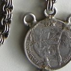 antique silver chain and coin